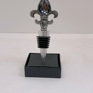 Gorgeous polished nickle Fleur de Lis bottle stopper.